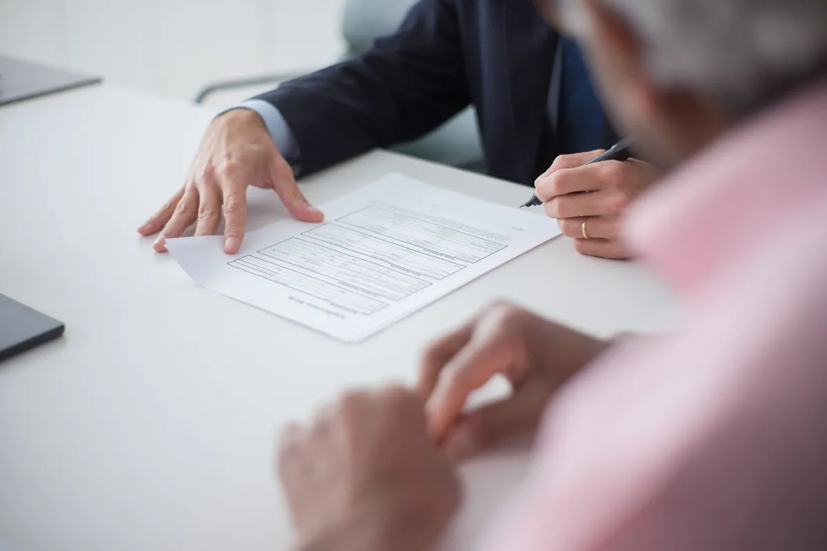 A stack of retainer agreements highlighting the importance of clear contracts in truck accident cases.